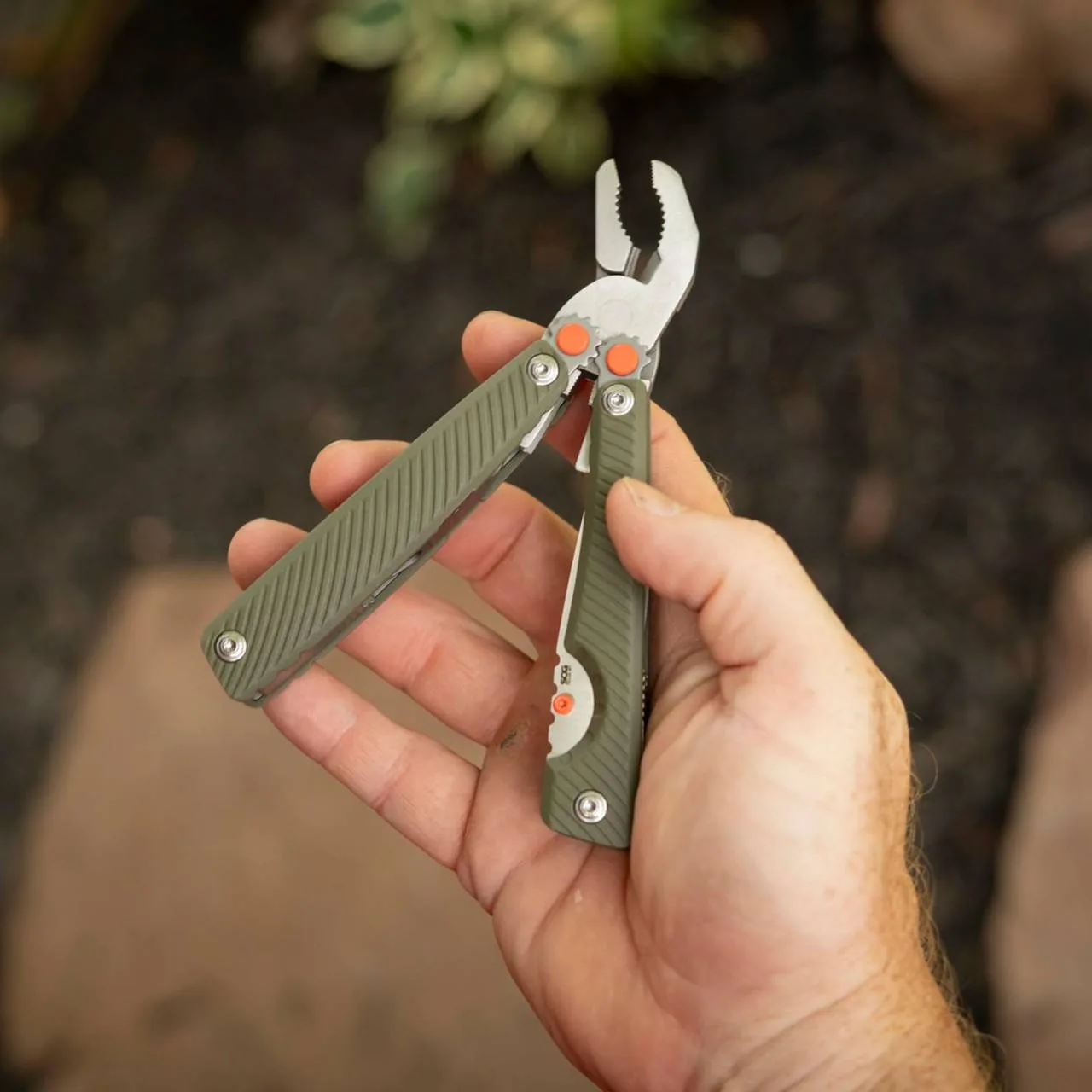 SOG Tellus MT multi-tool with G10 handle scales, open