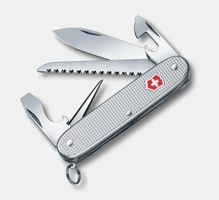 A silver Victorinox Swiss Army knife with a textured aluminum handle is shown with its large blade, saw, and bottle opener tools deployed.