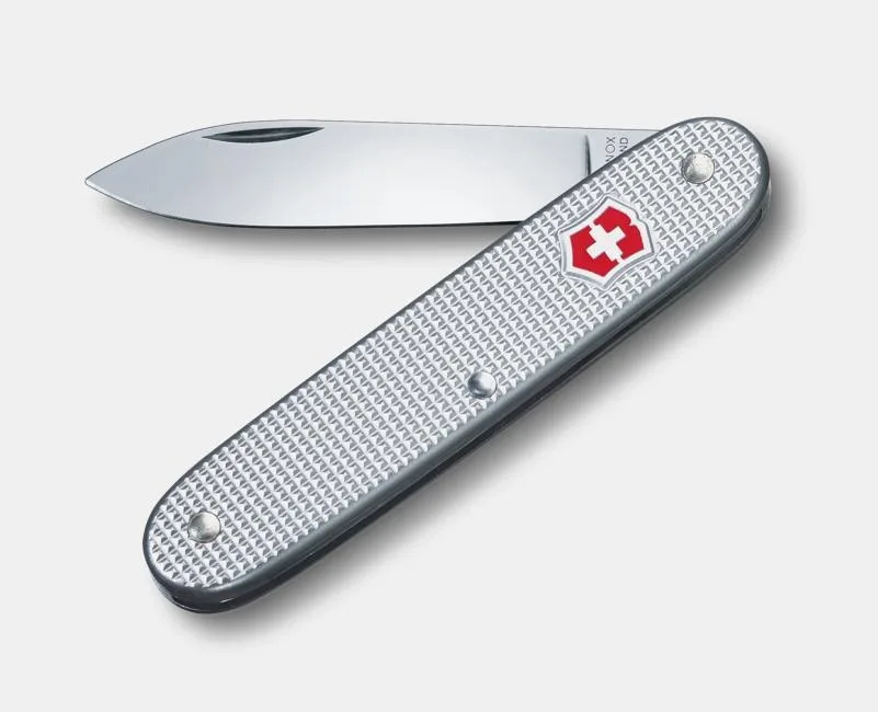 A silver Victorinox Swiss Army knife with a textured aluminum handle and the red cross shield logo, shown with its main blade extended.